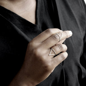 Silver triangle stack rings on a hand
