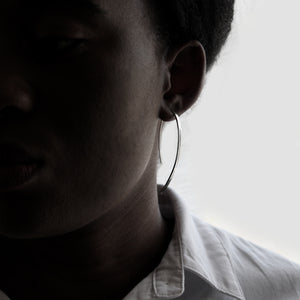 Silver Arch Earrings on model . Head-shot Frontview