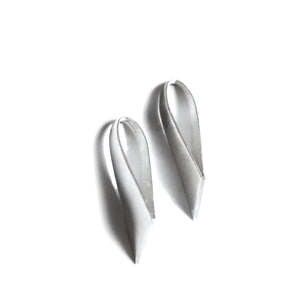 Silver stud earrings on white background