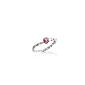 Silver ring with pink tourmaline on white background