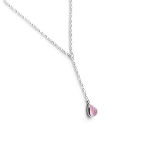 Tear drop shaped Rose Quartz on silver chain against white background