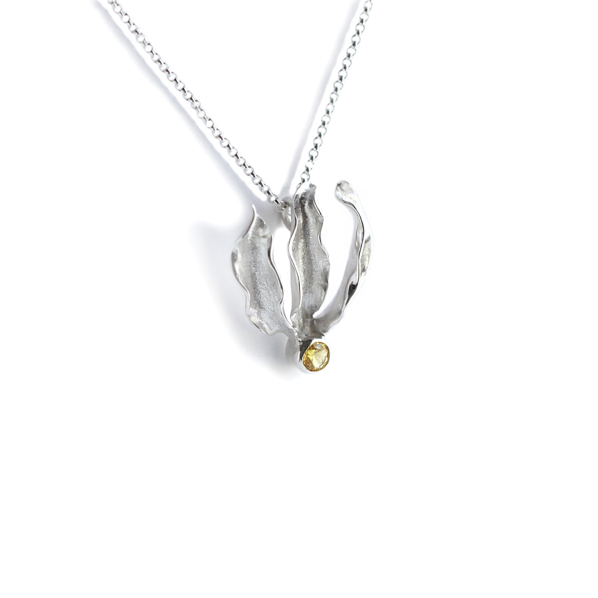 Silver flame lily pendant with citrine gemstone on chain. White background
