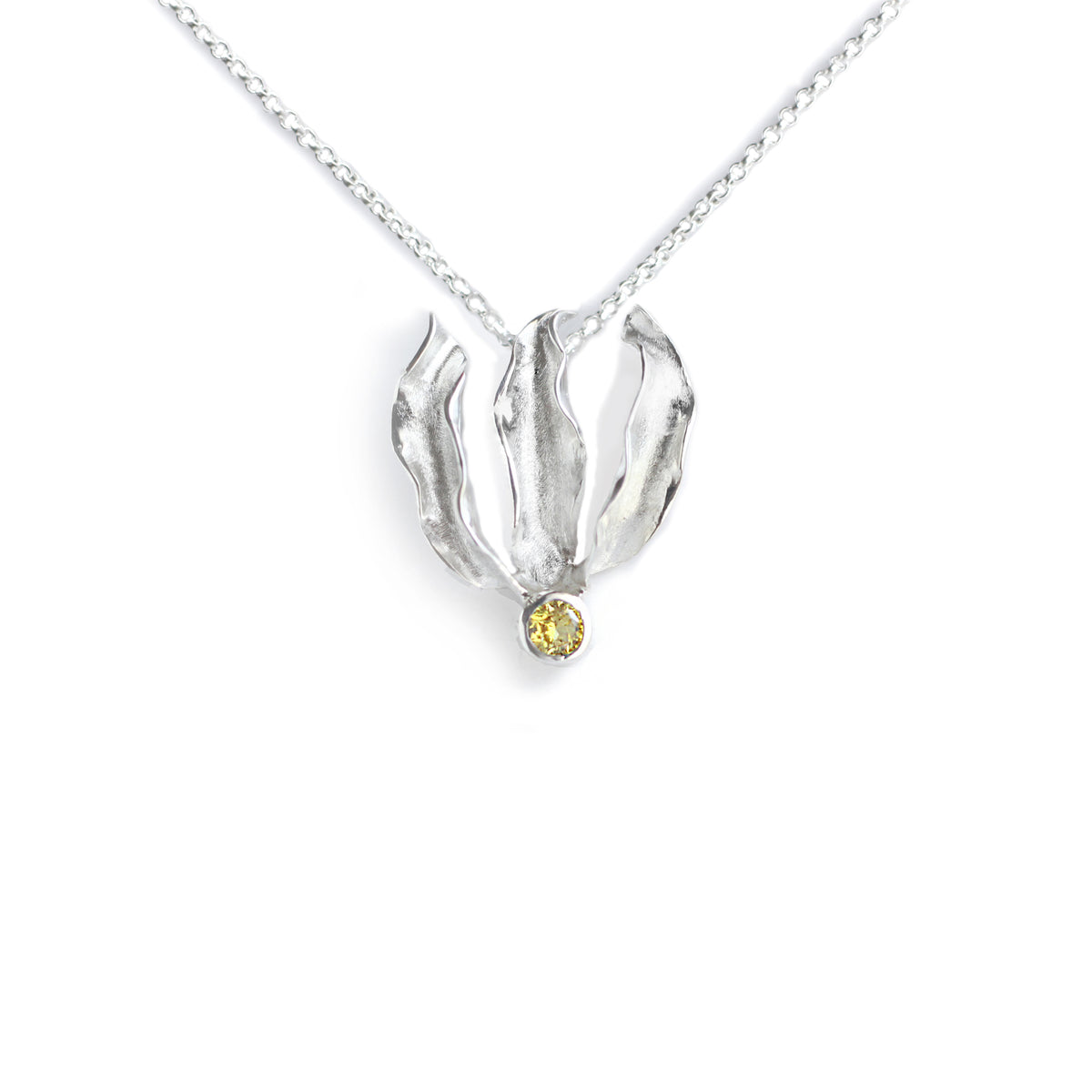 Silver flame lily pendant with citrine gemstone on chain. White background