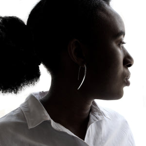 Silver Arch Earring on model. Side view head-shot