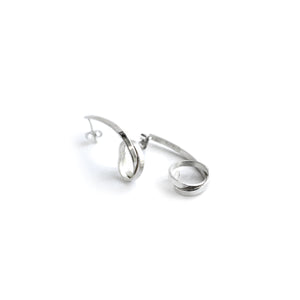 Loop silver stud earrings on white background. 