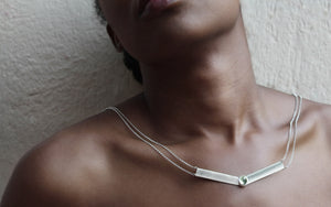 Silver pendant with moonstone on silver chain on a model