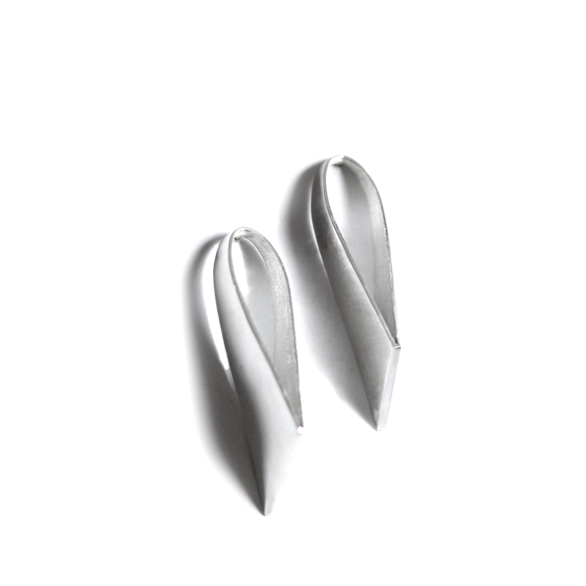 Silver stud earrings on white background