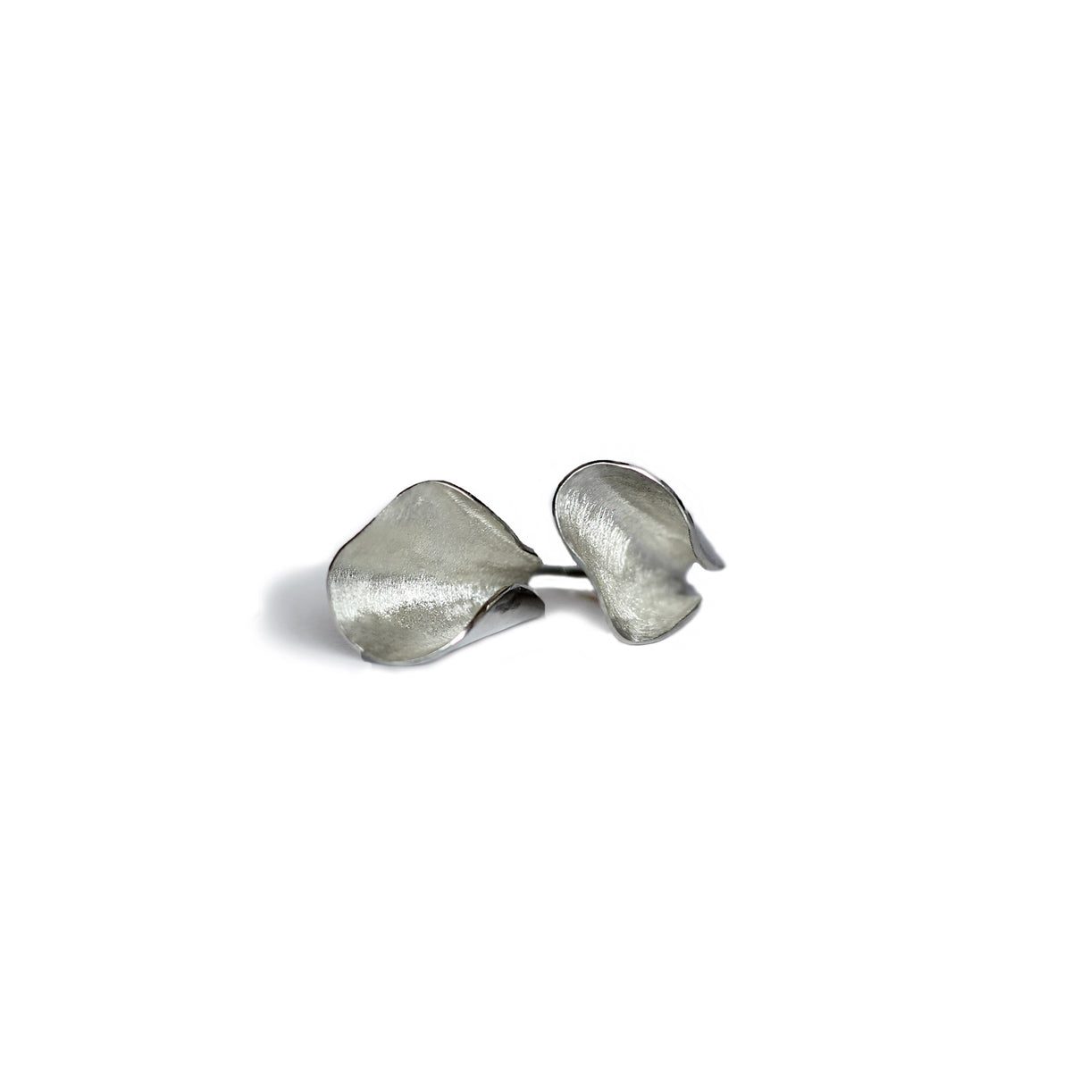 Silver Pod studs on white background