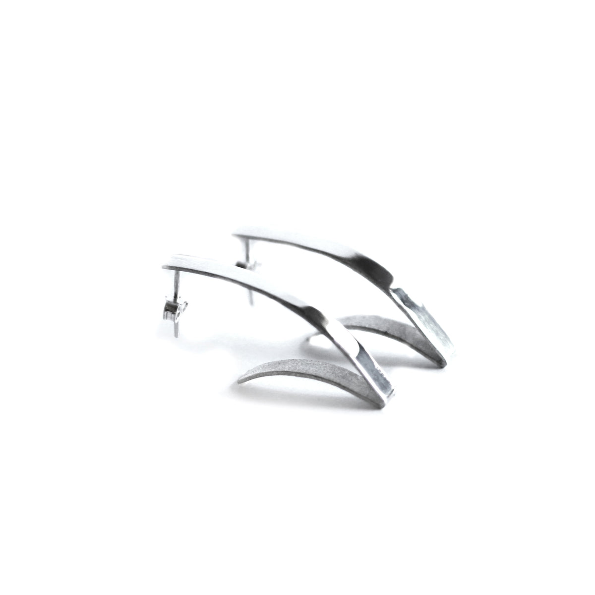  Curvy V shape earrings on white Background